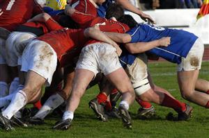 Grass-stained rugby scrum